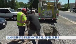 Construction crews continued working after an apparatus from the Branchville Volunteer Fire Dept. was parked in their way amid a land dispute in College Park.