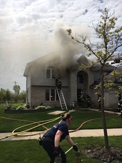 The initial size-up indicated smoke showing from the roof and attic soffits; however, the fire was ultimately found in multiple locations.