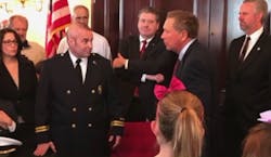 Beachwood Fire Capt. Michael Palumbo, pictured here with Ohio Gov. John Kasich on the day he signed the Michael Louis Palumbo Jr. Act into law, has died after a battle with occupational brain cancer.