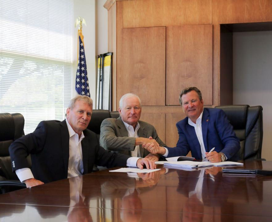 From left to right, Peter Darley, Larry Akins, and Paul Darley at the closing on June 6, 2017