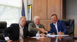 From left to right, Peter Darley, Larry Akins, and Paul Darley at the closing on June 6, 2017