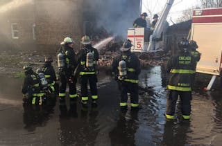 Thirty-two members of the Chicago Fire Department&apos;s brass resigned their positions and returned to the rank-and-file amid an ongoing pay and benefit dispute.