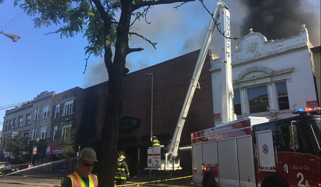 Nearly 150 firefighters battled a massive fire that consumed a furniture store Thursday morning in the Logan Square neighborhood on the city's Northwest Side.