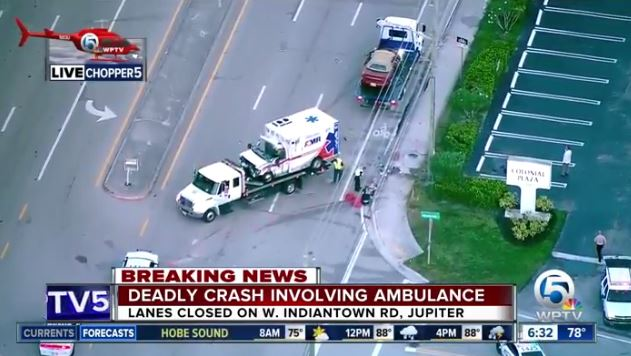 The American Medical Response ambulance and vehicle involved in the deadly crash are secured at the crash scene in Jupiter early Thursday.
