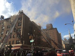 New York City firefighters tackle a five-alarm apartment building fire in Manhattan's East Village on Wednesday night. New York City firefighters tackle a five-alarm apartment building fire in Manhattan's East Village on Wednesday night.