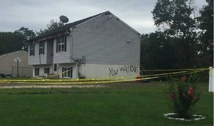 After the threatening message 'You Will Die' was found spray painted on a burning Vineland, NJ, home early Thursday, investigators are working to determine if it was arson.