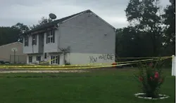 After the threatening message 'You Will Die' was found spray painted on a burning Vineland, NJ, home early Thursday, investigators are working to determine if it was arson.