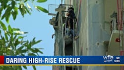 A Sarasota firefighter rappels down to rescue a construction worker who became trapped when the scaffolding he was on malfunctioned Monday. A Sarasota firefighter rappels down to rescue a construction worker who became trapped when the scaffolding he was on malfunctioned Monday.