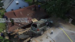An SUV traveling at high speed struck an embankment and launched into the air, coming to rest on the roof of an unoccupied St. Louis home Sunday afternoon.