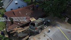 An SUV traveling at high speed struck an embankment and launched into the air, coming to rest on the roof of an unoccupied St. Louis home Sunday afternoon. An SUV traveling at high speed struck an embankment and launched into the air, coming to rest on the roof of an unoccupied St. Louis home Sunday afternoon.