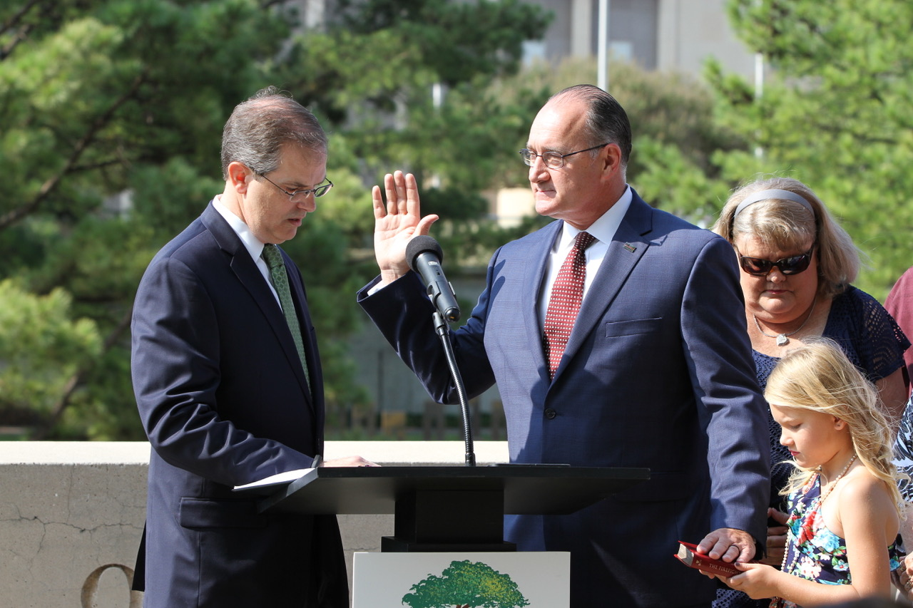 Bryant&rsquo;s granddaughter, Caitlyn, held the Bible as he was sworn in.