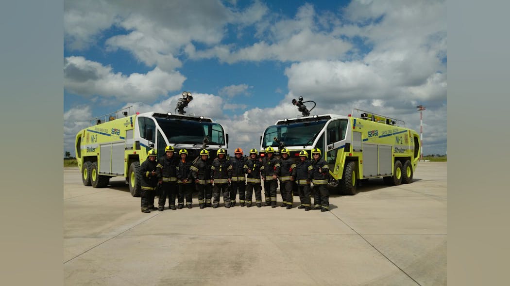 Oshkosh Airport Products is delivering three more Oshkosh&circledR; Striker&circledR; 6 X 6 aircraft rescue and fire fighting (ARFF) vehicles to airports administered and operated by Servicios Aeroportuarios Bolivianos S.A. (SABSA) for the country of Bolivia. Shown here are firefighters from Viru Viru International Airport in Santa Cruz alongside their matching pair of Striker ARFF vehicles.