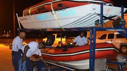 Firefighters with TN-TF 1 check their boats before responding to assist Texas crews in the wake of Hurricane Harvey.