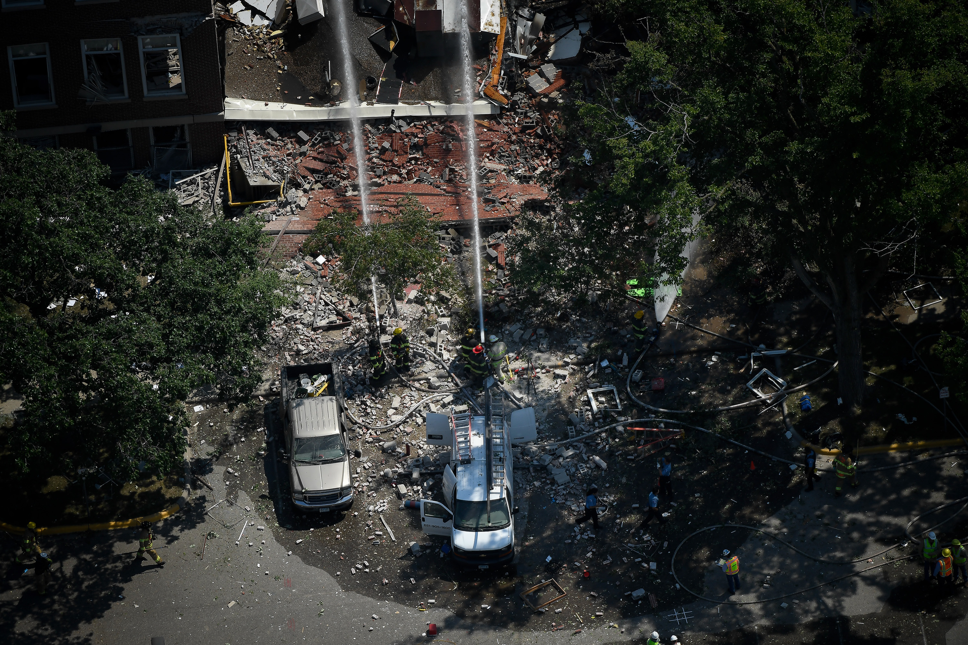 Emergency workers respond to the explosion at Minnehaha Academy Wednesday afternoon, Aug. 2, 2017 in Minneapolis, Minn.