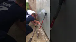 Chicago Firefighters Rescue Cat Stuck Under Metal Door