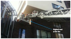 The ladder crew working where the fire started. The section of wall indicated with the bottom blue arrow is about 2 meters wide. The fire could pass the corner and create fire extension across the entire brick wall. The ladder crew working where the fire started. The section of wall indicated with the bottom blue arrow is about 2 meters wide. The fire could pass the corner and create fire extension across the entire brick wall.