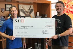 5.11 Tactical&rsquo;s CEO, Tom Davin, and VP of Global Marketing, Willem Driessen, holding a $20,000 check from 5.11 to the Sheepdog Survival Fund.
