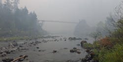 A smoky haze hovers in Oregon&apos;s Illinois River Valley as efforts to contain the massive Chetco Bar Fire continue.