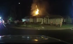 This image from a dashcam video shows firefighters setting up to tackle a house fire in Eagle Point, OR, on Monday. This image from a dashcam video shows firefighters setting up to tackle a house fire in Eagle Point, OR, on Monday.
