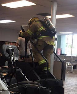 A woman who was working out at Rhodes Fitness in Gulfport, MS, on Monday snapped this photo of firefighter Collin Stuart climbing the equivalent of 110 flights of stairs to honor those who died on 9/11. A woman who was working out at Rhodes Fitness in Gulfport, MS, on Monday snapped this photo of firefighter Collin Stuart climbing the equivalent of 110 flights of stairs to honor those who died on 9/11.