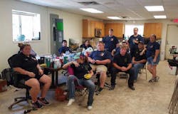 The men and women of the Plum Grove, TX, Fire Department eight days after Hurricane Harvey made landfall and devastated their town. They went right back to work after this meeting.