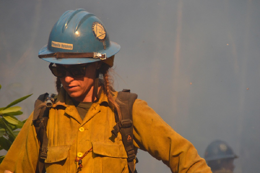 Firefighter Tara Perkins of the Prineville Hotshots is pictured Monday during efforts to contain the massive Chetco Bar Fire burning in southwest Oregon.