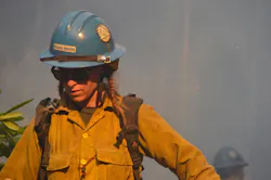 Firefighter Tara Perkins of the Prineville Hotshots is pictured Monday during efforts to contain the massive Chetco Bar Fire burning in southwest Oregon.