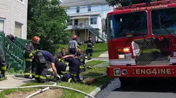 Scranton, PA, firefighters begin to wrap up their gear after a response in June.
