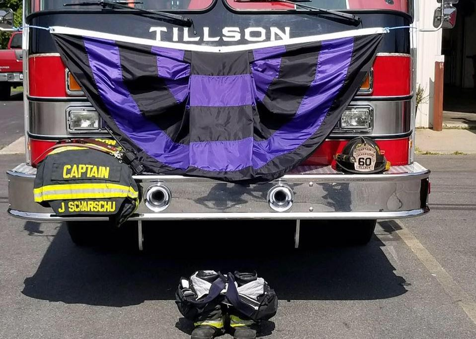 A makeshift memorial sits in front of the fire station in Tillson, NY, after firefighter Justin Scharschu was killed early Monday when a massive tree fell on his pickup while he was driving.