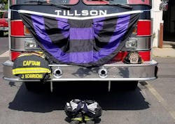 A makeshift memorial sits in front of the fire station in Tillson, NY, after firefighter Justin Scharschu was killed early Monday when a massive tree fell on his pickup while he was driving. A makeshift memorial sits in front of the fire station in Tillson, NY, after firefighter Justin Scharschu was killed early Monday when a massive tree fell on his pickup while he was driving.