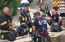 A group of Trenton firefighters cool down and hydrate during a call in July. A group of Trenton firefighters cool down and hydrate during a call in July.
