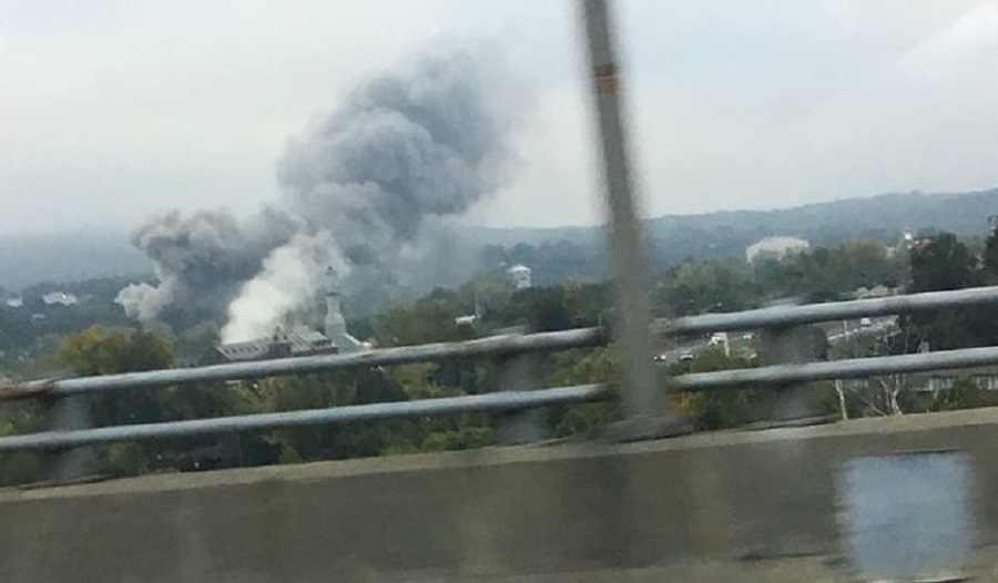 Smoke rises from a furniture store fire early Monday morning in Waterbury, CT.