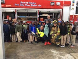 Burton firefighters work with “100 Strong Voices,” comprised of “at risk” students in the school system. Burton firefighters work with “100 Strong Voices,” comprised of “at risk” students in the school system.