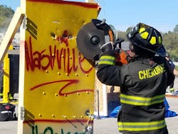 A firefighter works on urban forcible entry at the Nashville Fire Academy on Wednesday, Oct. 18, 2017.
