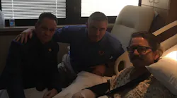 Los Angeles City firefighter Frank Lima, left, tweeted this photo after visiting an unidentified San Bernardino County firefighter who was shot in the arm in Las Vegas on Sunday night while rendering CPR.