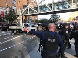 The NYPD's Counterterrorism Unit was on scene after an alleged terrorist drove the rented pickup truck seen in the background along a bike path in lower Manhattan on Tuesday, killing eight people. The NYPD's Counterterrorism Unit was on scene after an alleged terrorist drove the rented pickup truck seen in the background along a bike path in lower Manhattan on Tuesday, killing eight people.