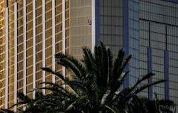 A curtain blows out of a broken window where a gunman opened fire from an upper story of the Mandalay Bay resort on a country music festival across the street on the Las Vegas Strip on Sunday night, leaving at least 58 dead and more than 500 injured. A curtain blows out of a broken window where a gunman opened fire from an upper story of the Mandalay Bay resort on a country music festival across the street on the Las Vegas Strip on Sunday night, leaving at least 58 dead and more than 500 injured.