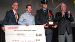 Firehouse Editor-in-Chief Tim Sendelbach (left) and Chief Michael O. McNamee (right) present a check to FDNY firefighter James P. Lee Jr., (second from right) the recipient of the 2016 Michael O. McNamee Award of Valor. Robert Daus, Jr. vice president of Liberty Art Works, also presented a custom medal to Lee.