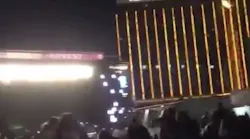 People flee the concert after a gunman opened fire at Mandalay Bay.