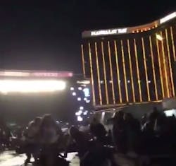 People flee the concert after a gunman opened fire at Mandalay Bay.