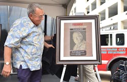 Alan Brunacini unveils his plaque during the Firehouse Hall of Fame induction ceremony at Firehouse Expo 2015.
