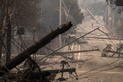 Power poles and lines block a street at Brookdale and Aaron Dr. in Hidden Valley, CA, where most of the homes were destroyed by fire in Santa Rosa on Oct. 9, 2017. Power poles and lines block a street at Brookdale and Aaron Dr. in Hidden Valley, CA, where most of the homes were destroyed by fire in Santa Rosa on Oct. 9, 2017.