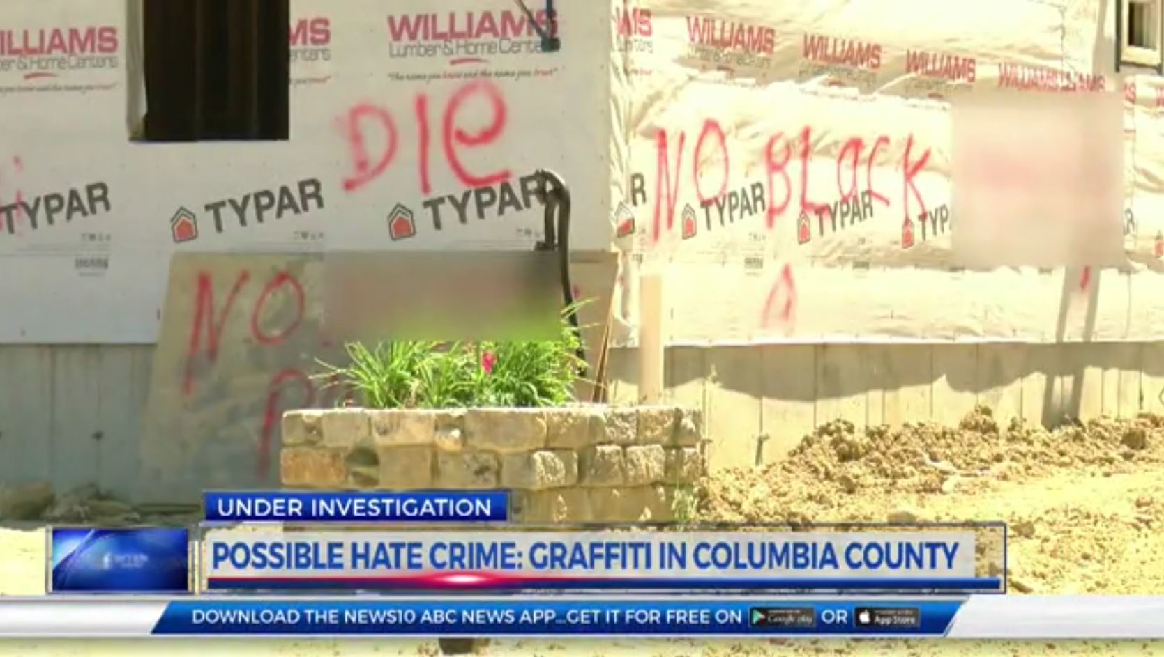 Racist graffiti can be seen on a home under construction this past summer that was burned down on Monday, Oct. 23, 2017.