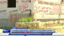 Racist graffiti can be seen on a home under construction this past summer that was burned down on Monday, Oct. 23, 2017.