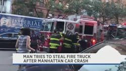 FDNY firefighters reach into the cab of a fire apparatus in Manhattan on Sunday after a man jumped inside and tried to steal the vehicle at the scene of a multiple-car collision.