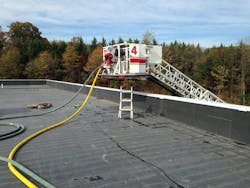 The flying standpipe being used to supply two handlines through the use of the discharge outlet located on the bucker of the aerial ladder. The flying standpipe being used to supply two handlines through the use of the discharge outlet located on the bucker of the aerial ladder.