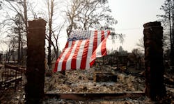 A U.S. flag hangs from the remnants of a fire-ravaged home on Willowview Court in the Coffee Park neighborhood of Santa Rosa, CA, on Oct. 18, 2017. A U.S. flag hangs from the remnants of a fire-ravaged home on Willowview Court in the Coffee Park neighborhood of Santa Rosa, CA, on Oct. 18, 2017.