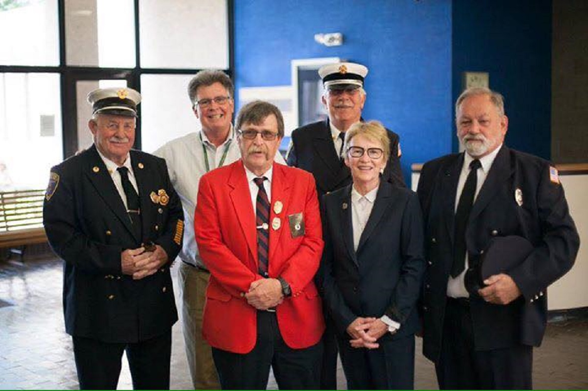New York Assemblywoman Aileen Gunther with fire officials on Oct. 23, 2017, the day Gov. Andrew Cuomo signed a bill she championed into law that expands cancer coverage for volunteer firefighters.