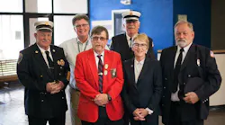 New York Assemblywoman Aileen Gunther with fire officials on Oct. 23, 2017, the day Gov. Andrew Cuomo signed a bill she championed into law that expands cancer coverage for volunteer firefighters.