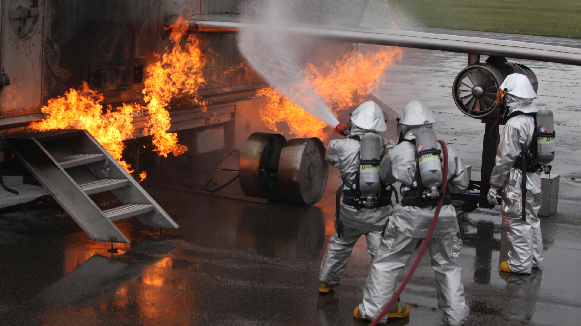 Marines with Aircraft Rescue and Firefighting partner with members of the Wilmington Fire Department during training at Marine Corps Air Station Cherry Point, NC, on April 30, 2015.